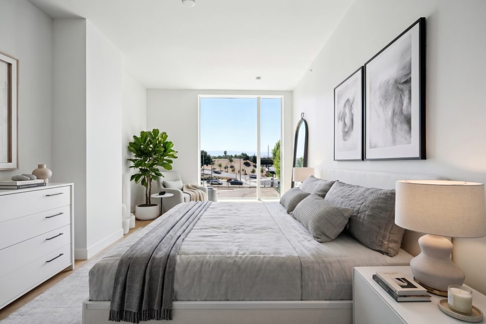 Bedroom virtually staged by TINTY in Minimalist style with taupe accents, with a tall window at the far end